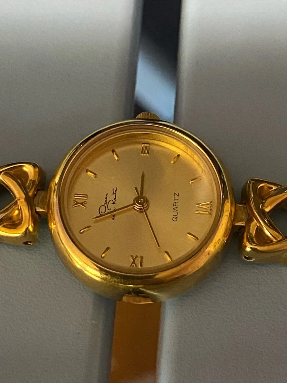 Decan De La Renta gold tone designer watch
